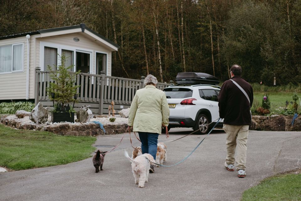 Dog walkers by a holiday home