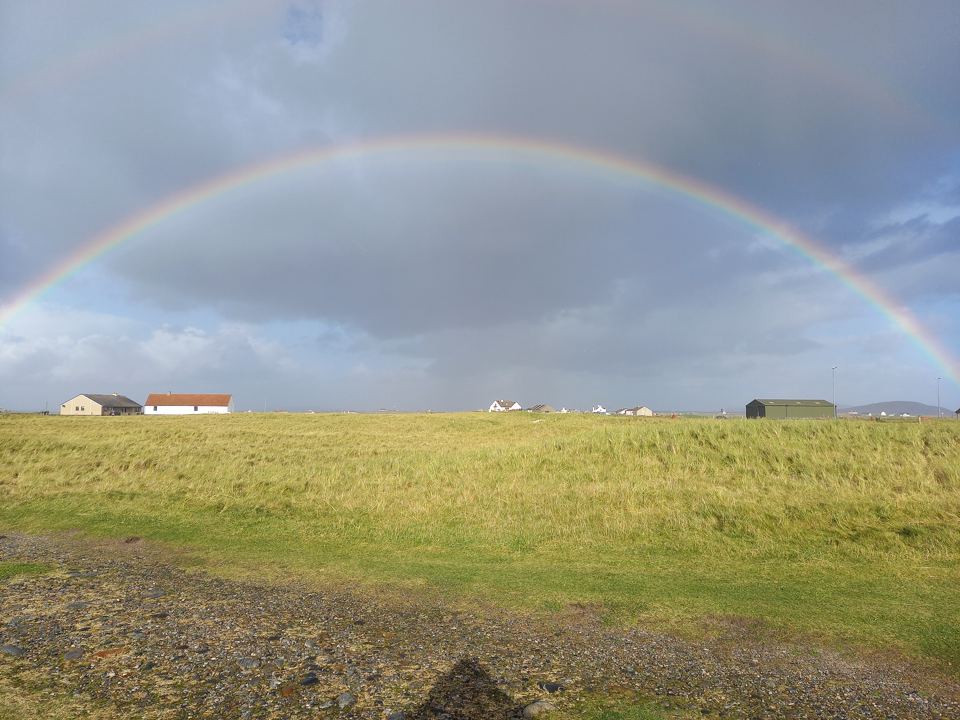 Machair field under a rainbow