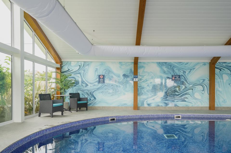 Indoor pool with marble wall