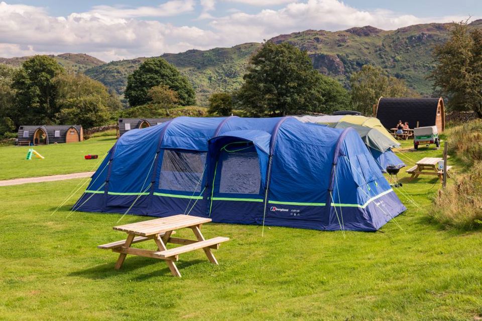 Tent on the pitch below the fell