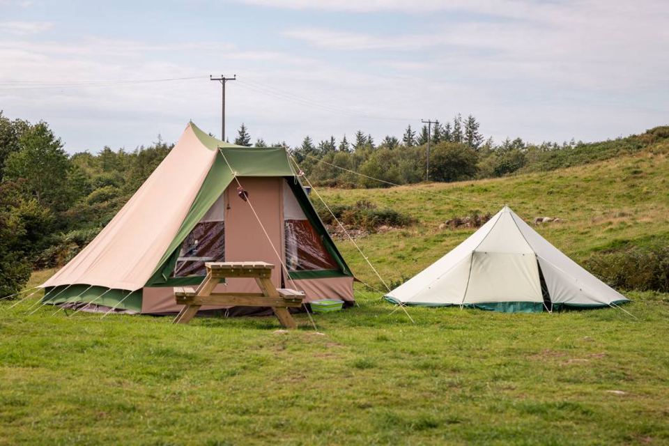 Canvas tent and bell tent on the grass