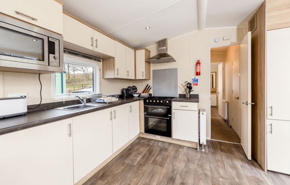 Caravan kitchen with white units