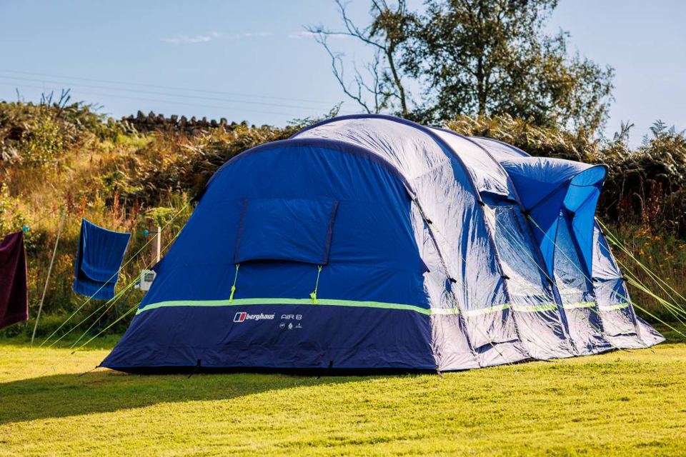 Large blue tent on the grass