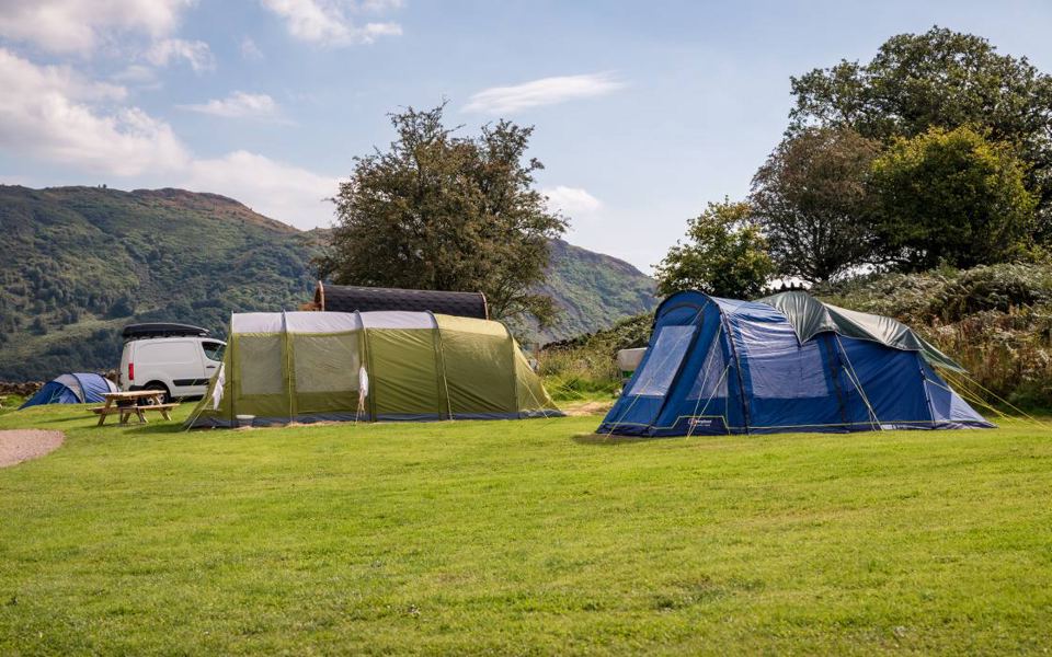 Tent pitch with hills behind