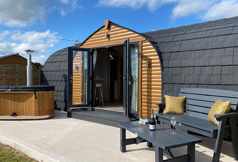 Pod with hot tub and bench