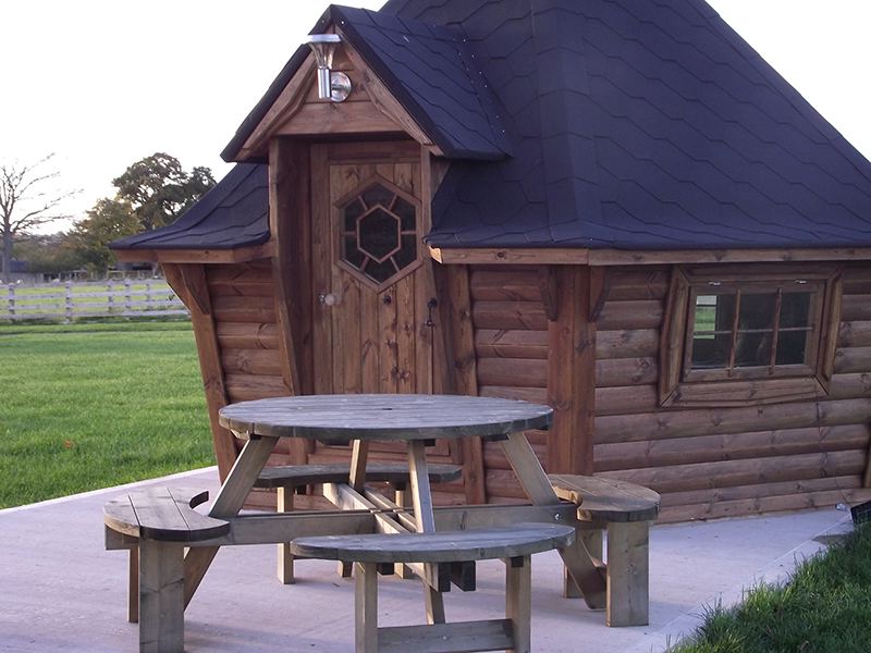 Timber lodge with picnic tables