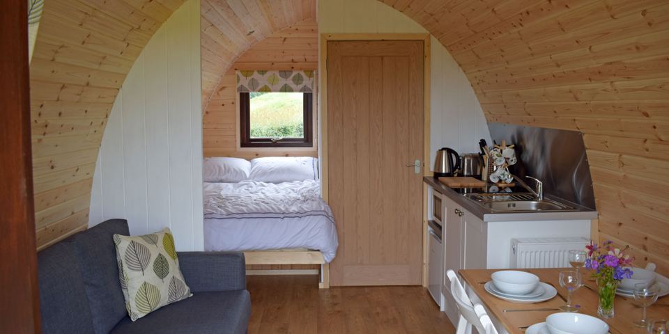 Inside a pod, bed and kitchen