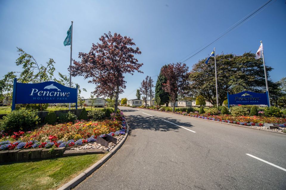 Park entrance with flower beds