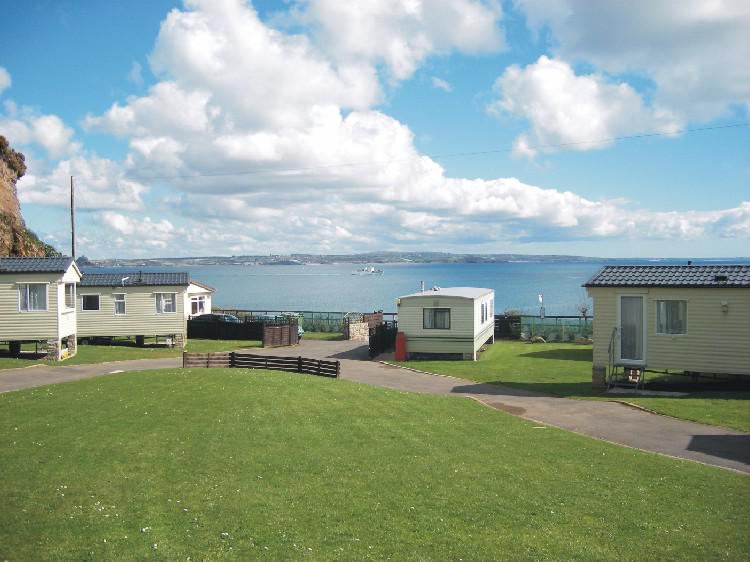 Caravans on the grass by the sea