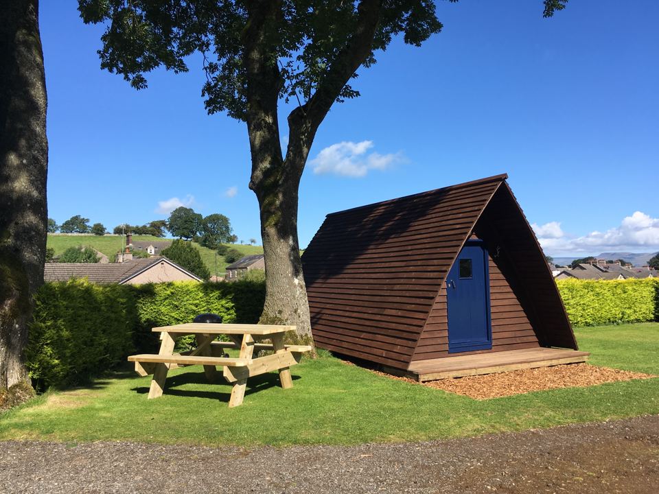 Wooden pod with picnic bench