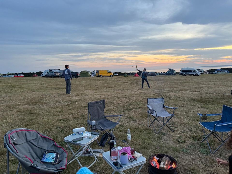 Camp chairs on the grass field