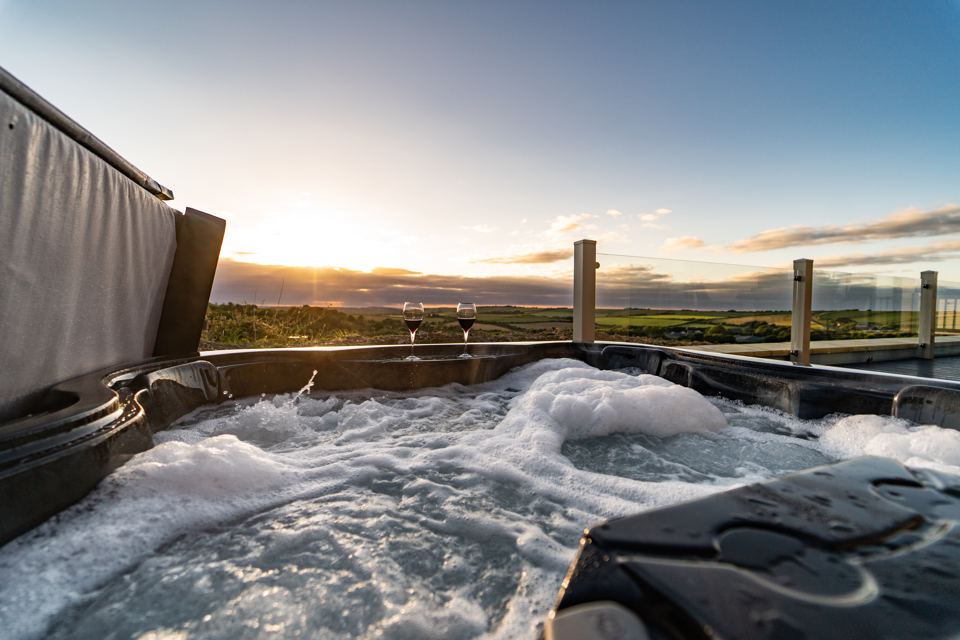 Hot tub on the decking at sunset