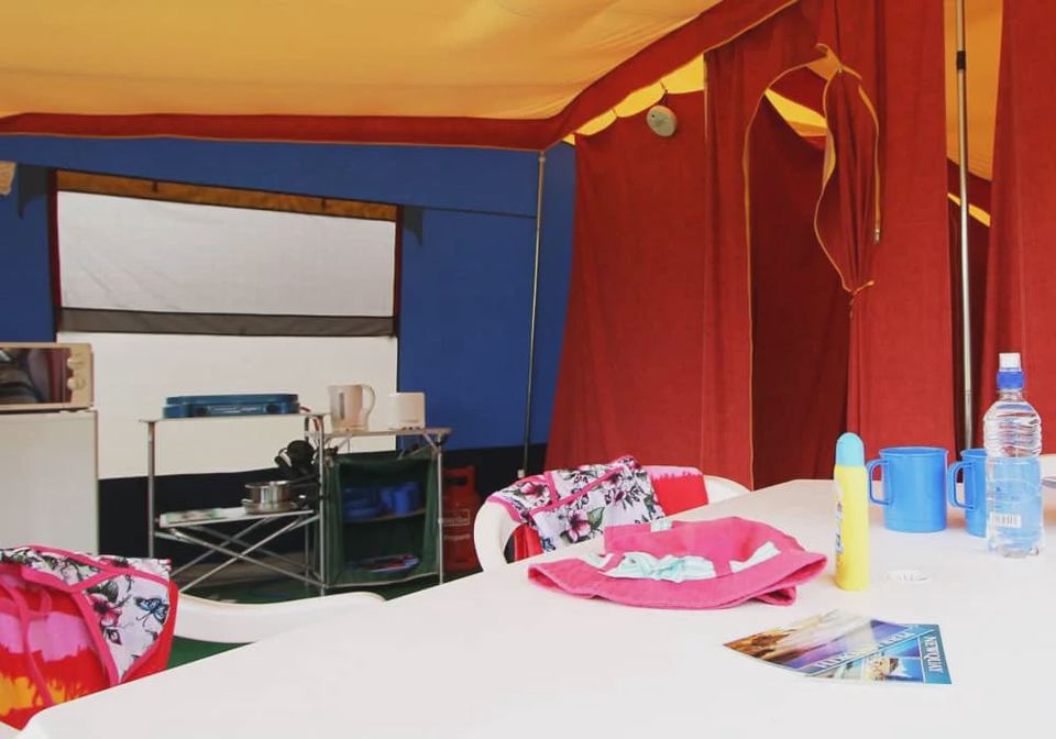 Inside the canvas tent with chairs