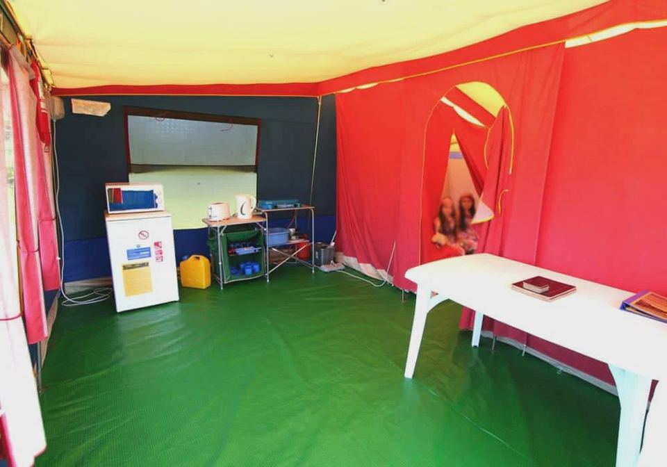 Inside the canvas tent with table