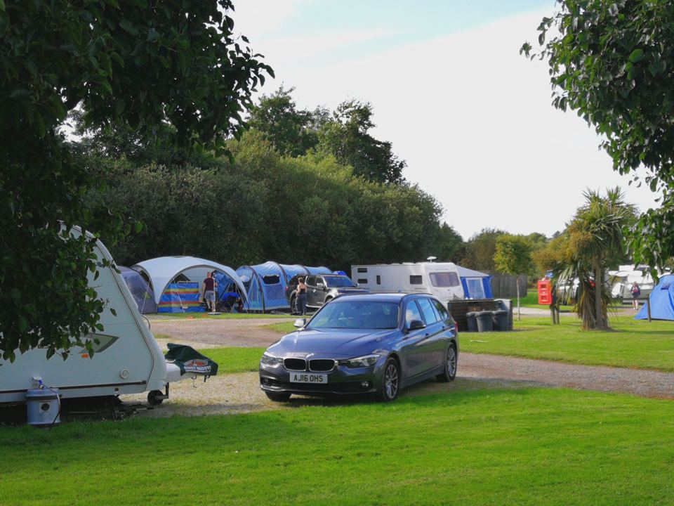 Pitches with a car and tents