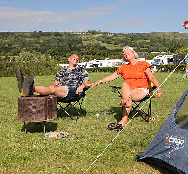Grass pitches with hills behind