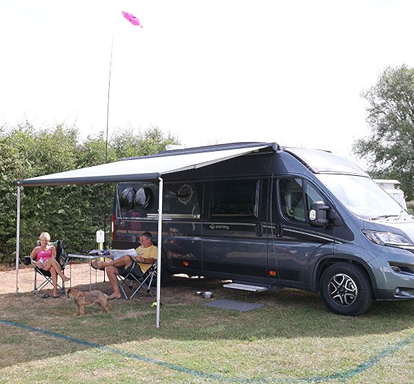 Campervan with awning on hardstanding