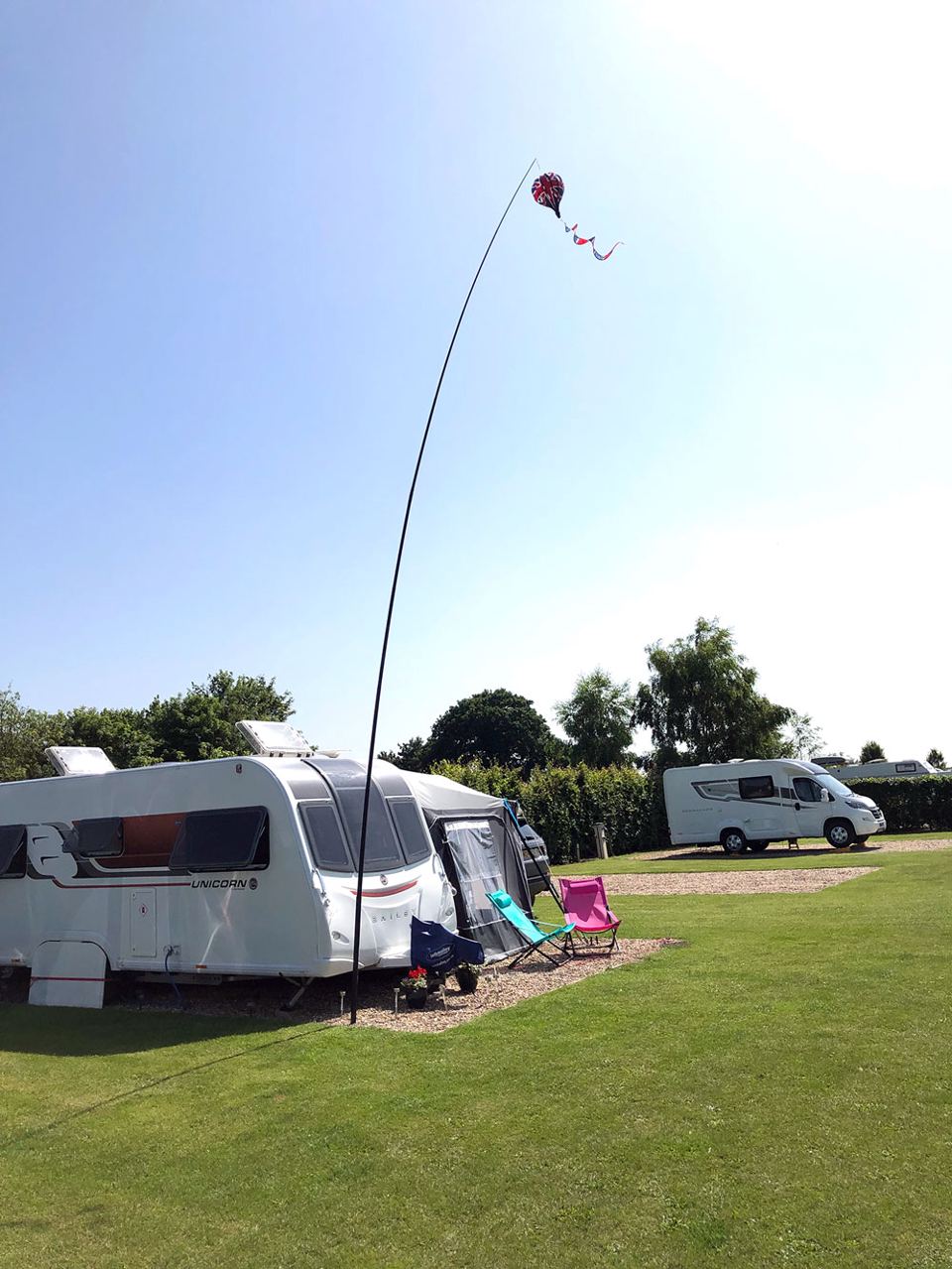 Caravan on open grass