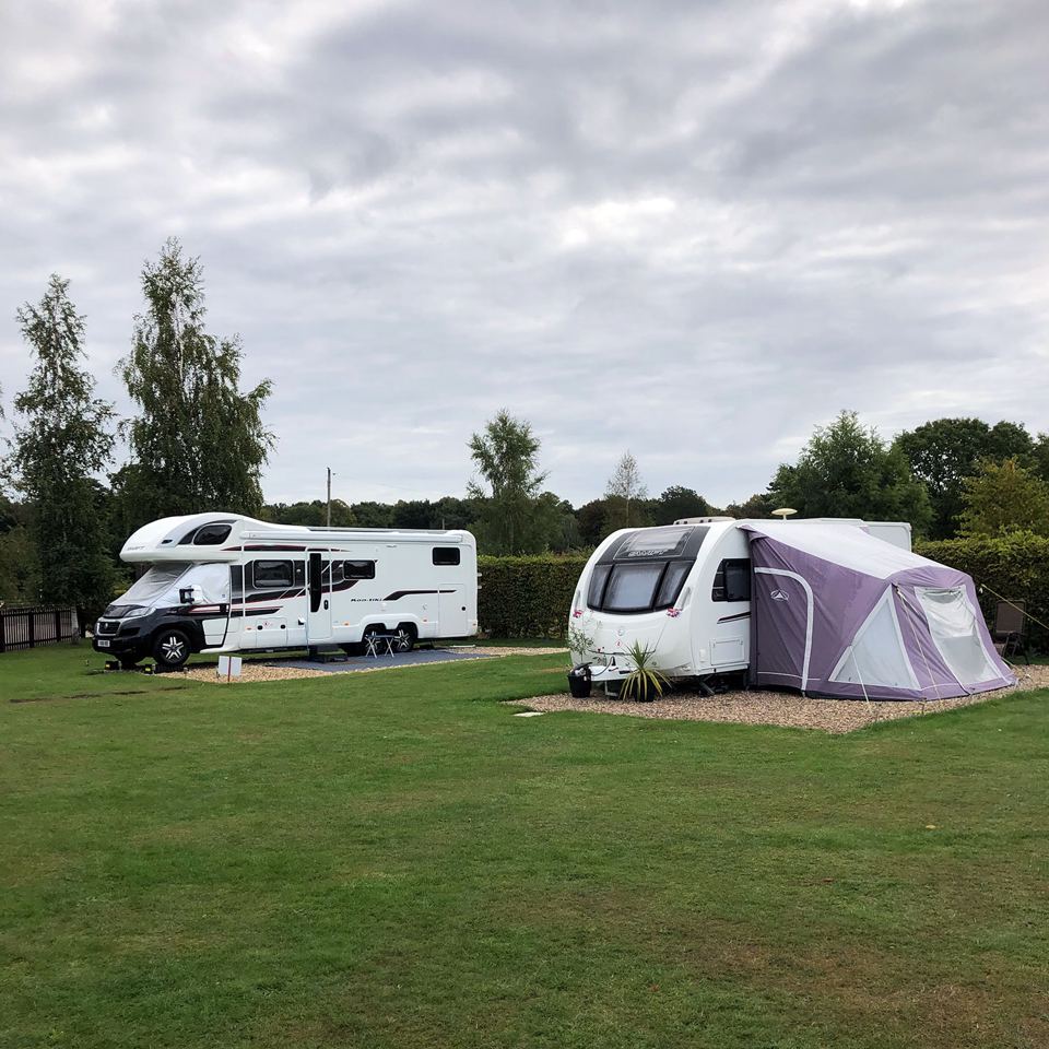 Motorhome and caravan on grass