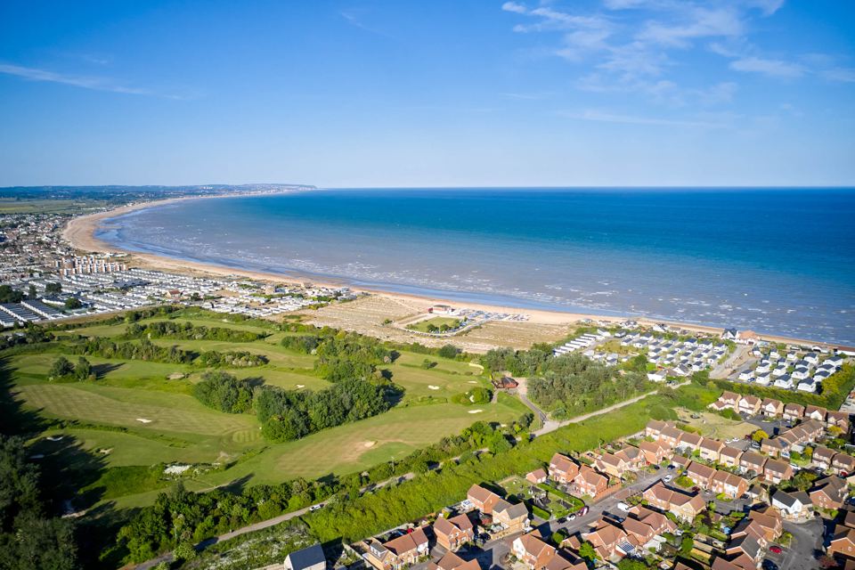 Golf course and coast from above