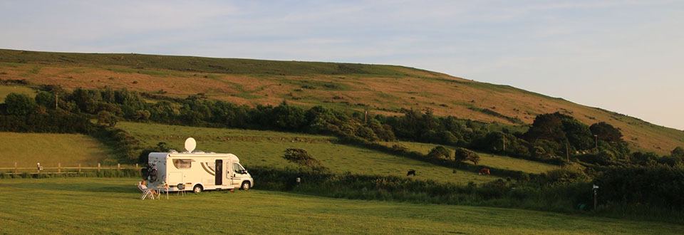 Motorhome on a sloping field