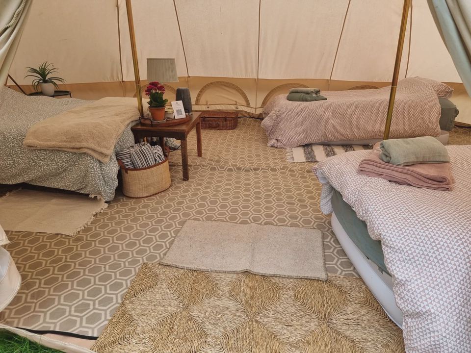 Beds inside the large bell tent