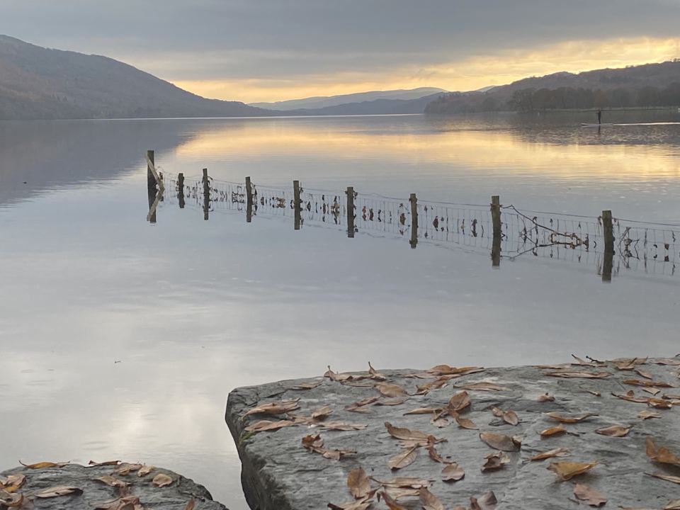 Lake and posts at dusk