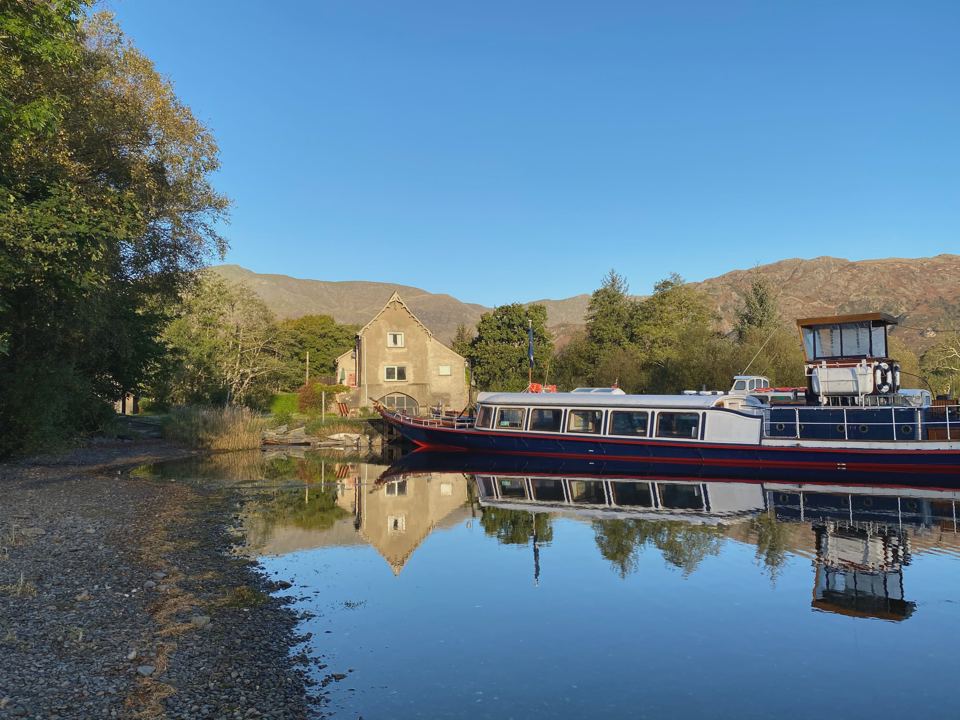 Boat moored by the stone cottage
