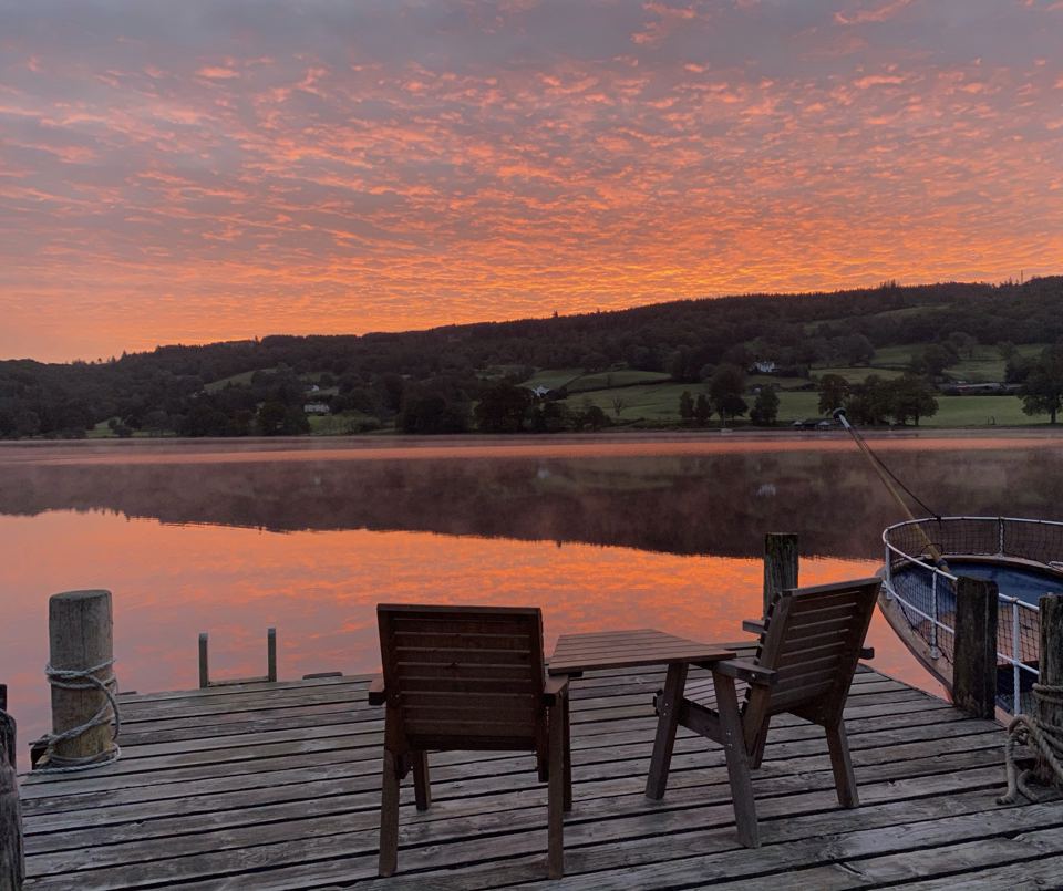 Chairs on the jetty at sunset