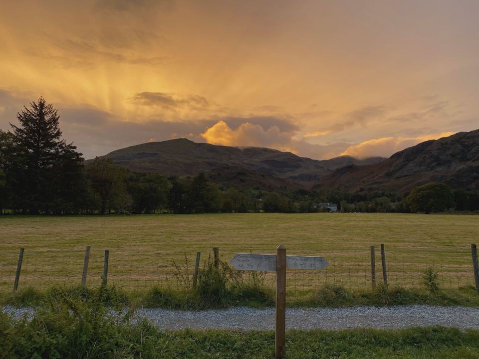 Sunset over fields and hills