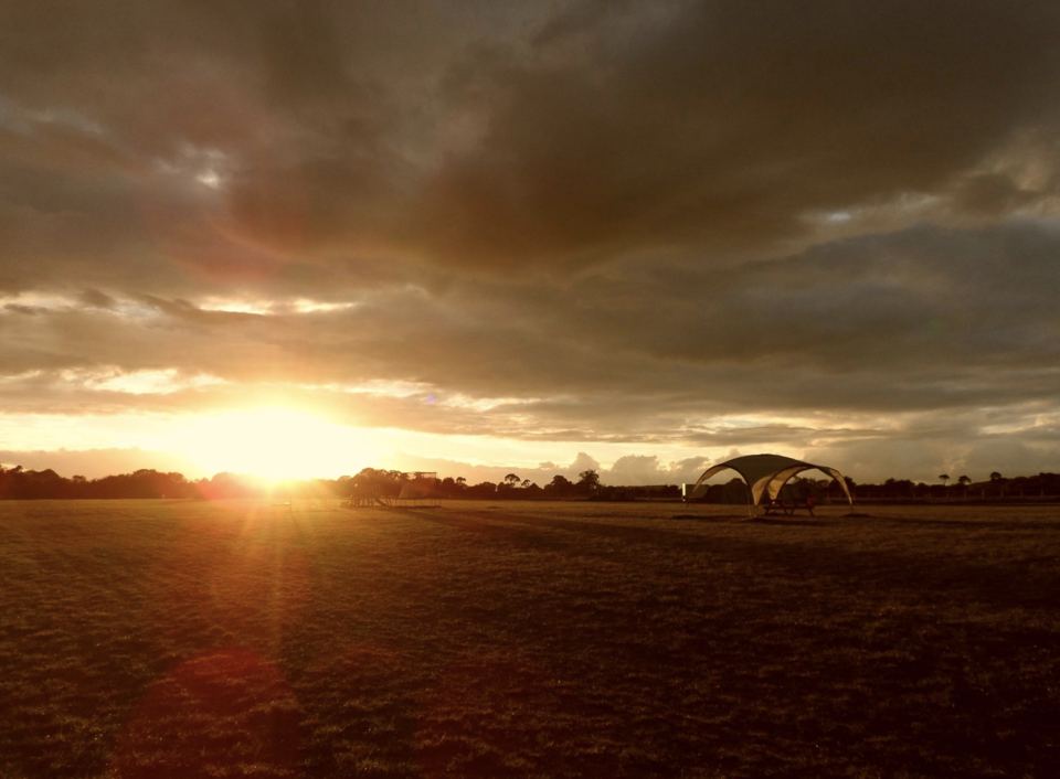 Camping field at sunset