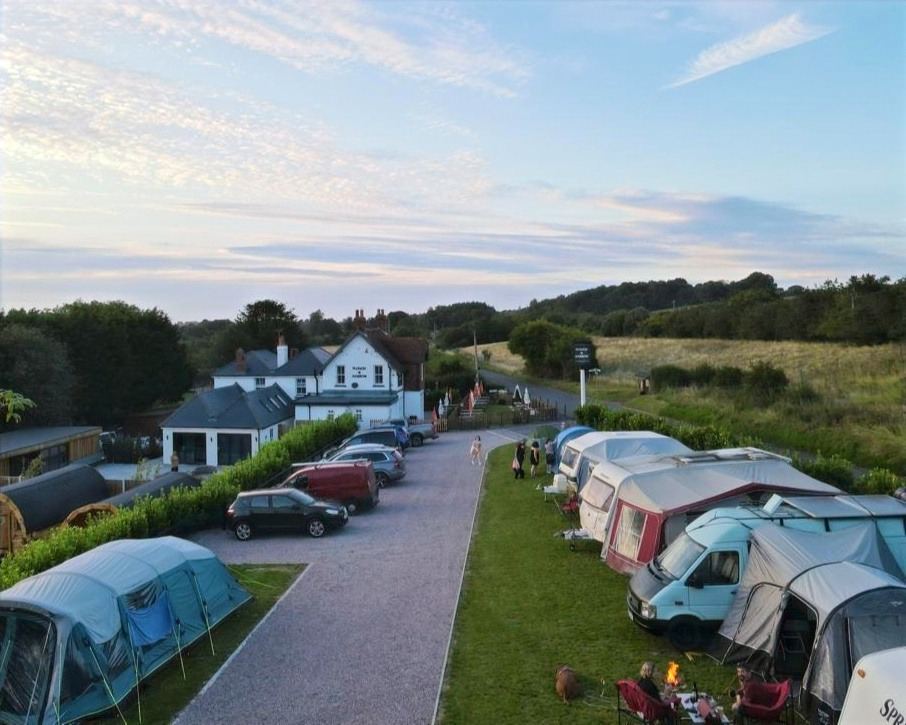 Tents and vans beside the pub