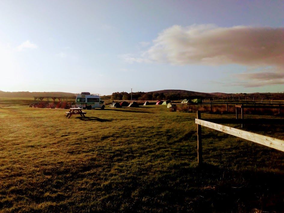 Tent pitches at sunset