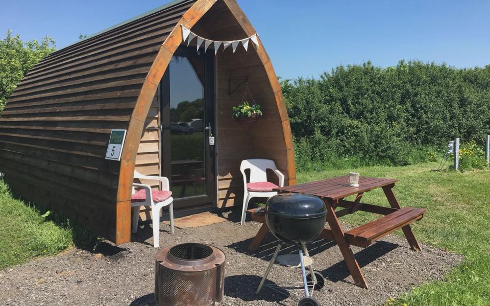 Camping pod with fire ring