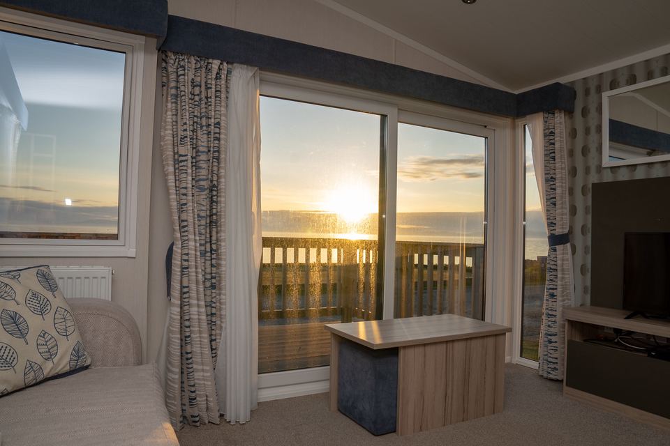 Static caravan lounge with sea view