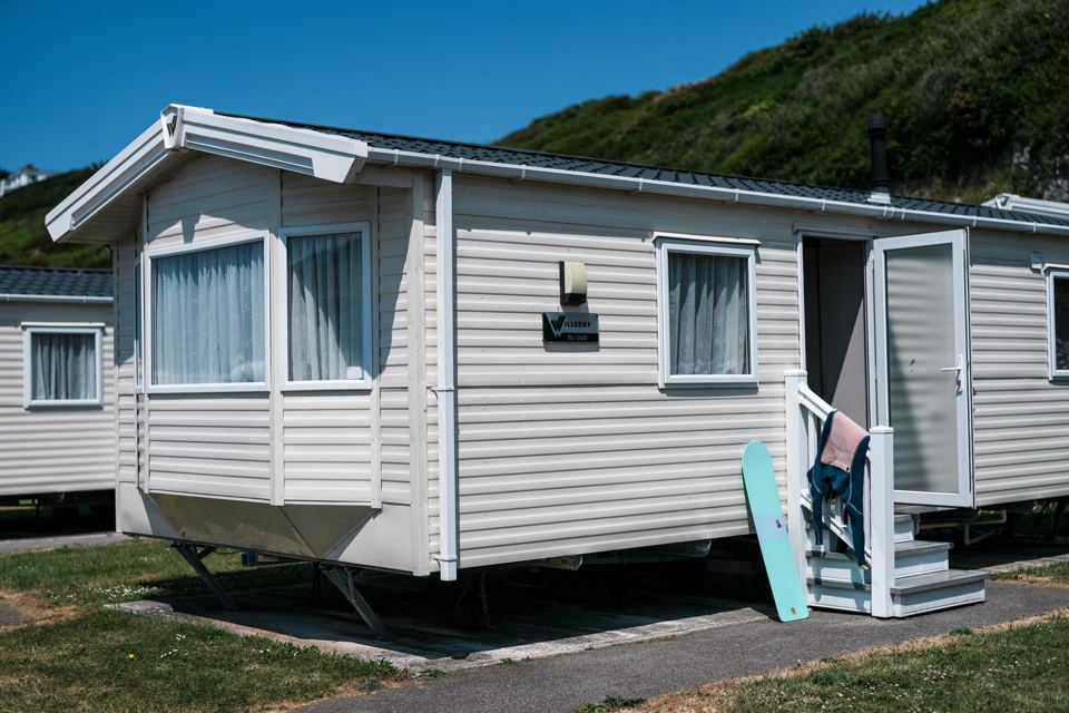 Caravan with a surfboard