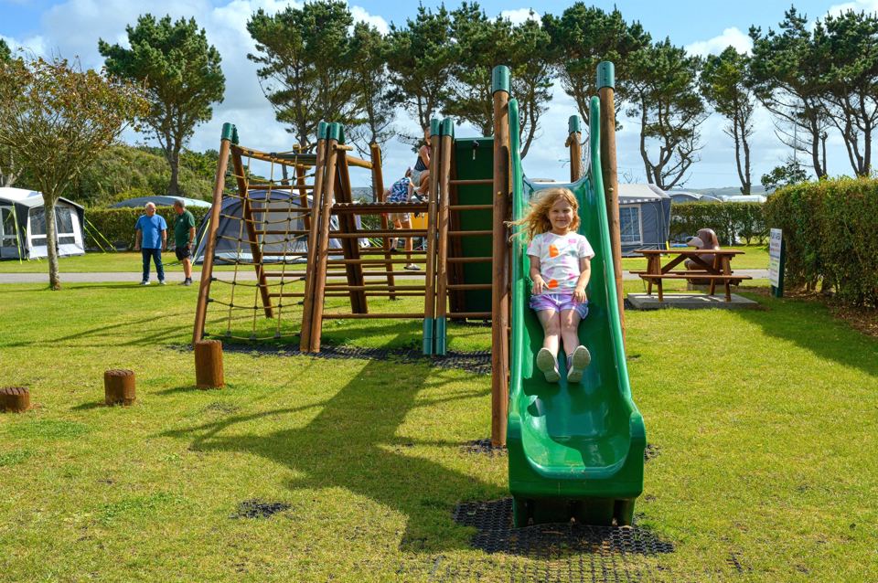 Green slide and climbing frame