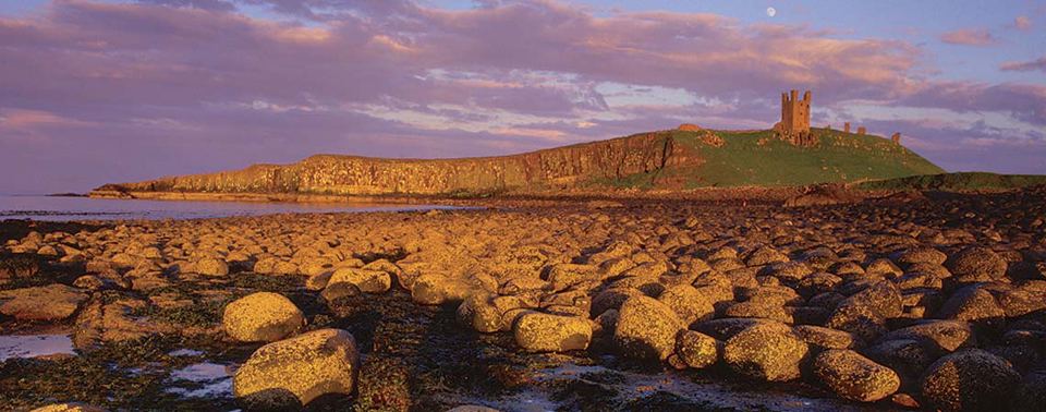 Dunstanburgh Castle at sunset