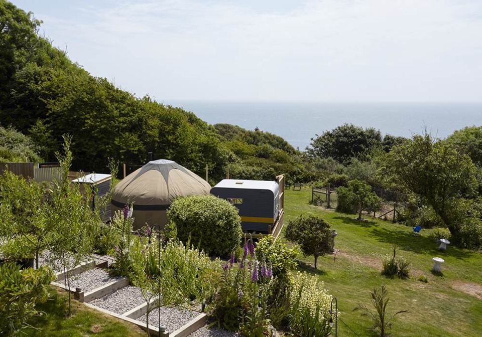 Yurt and vintage caravan in the garden