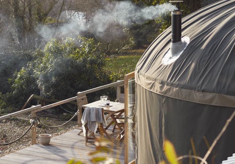 Yurt and decking with smoking chimney