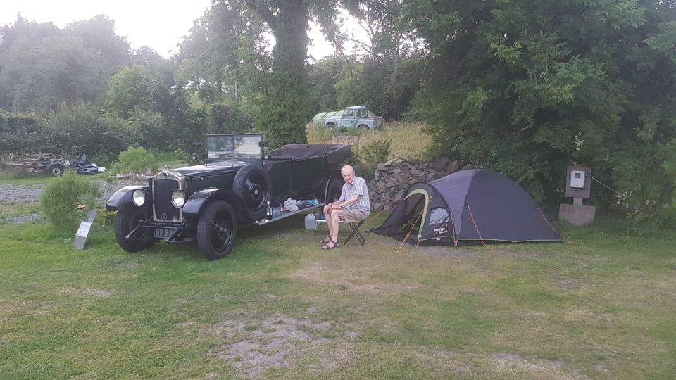 Tent beside a vintage car