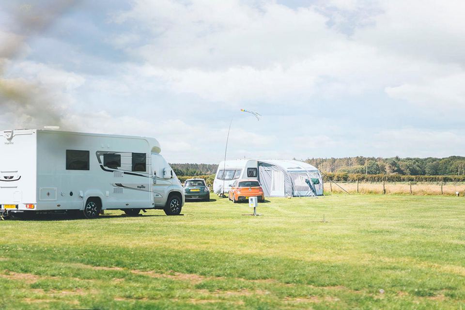 Motorhome and tourer on grass