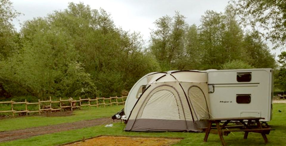 Caravan and awning on grass