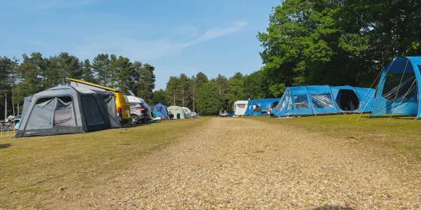 Tents and caravans along the gravel track