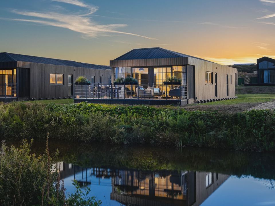 Barn lodge at dusk by the lake