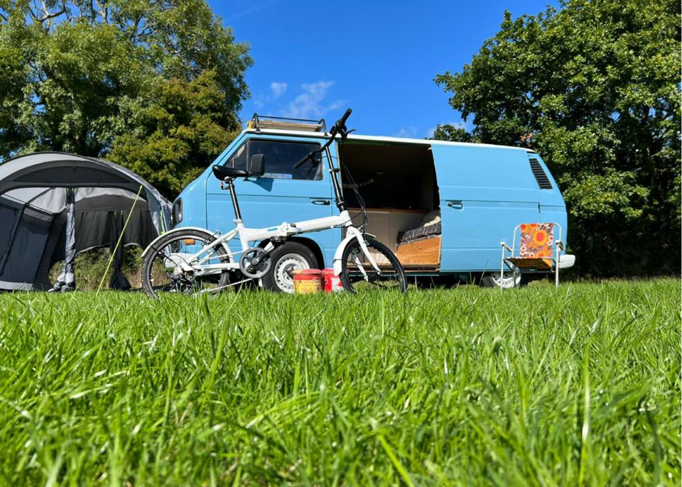 Campervan pitched on grass