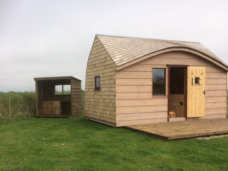 Larger pod with wooden cladding