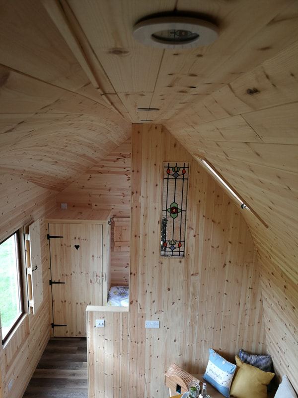 Narrow pod interior with seating