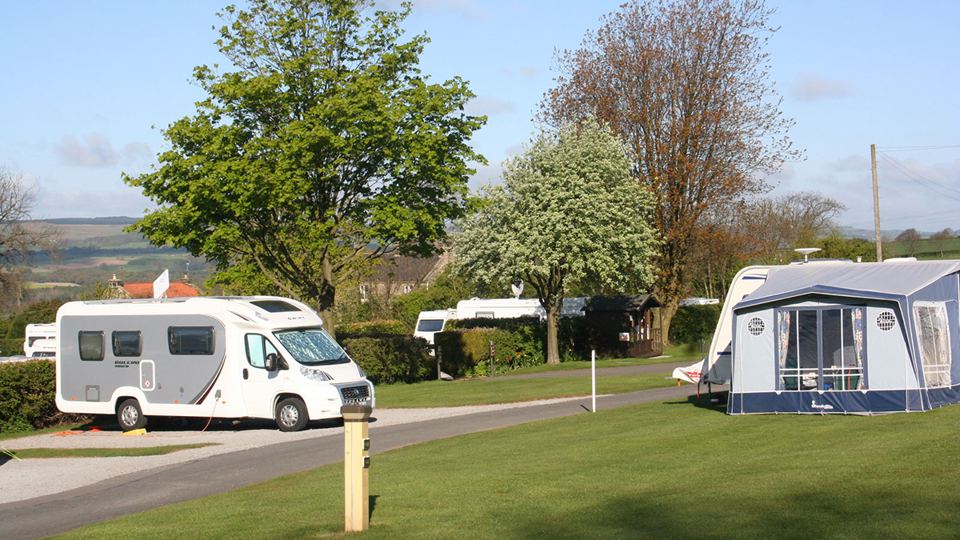 Motorhome and awning on grass