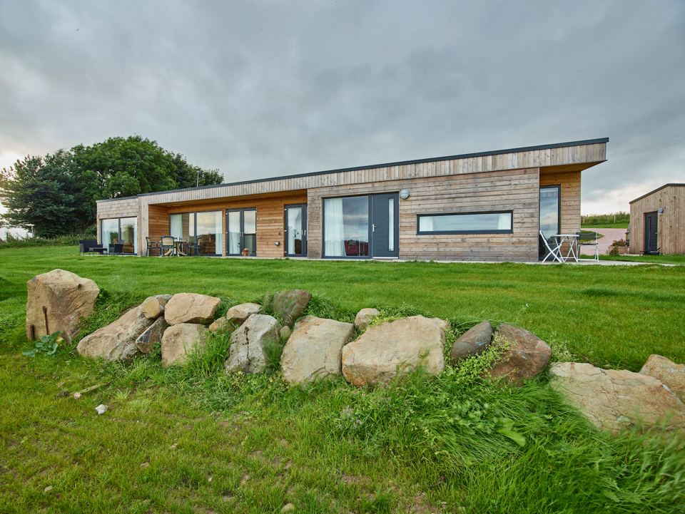 Timber-clad cottage on the farm